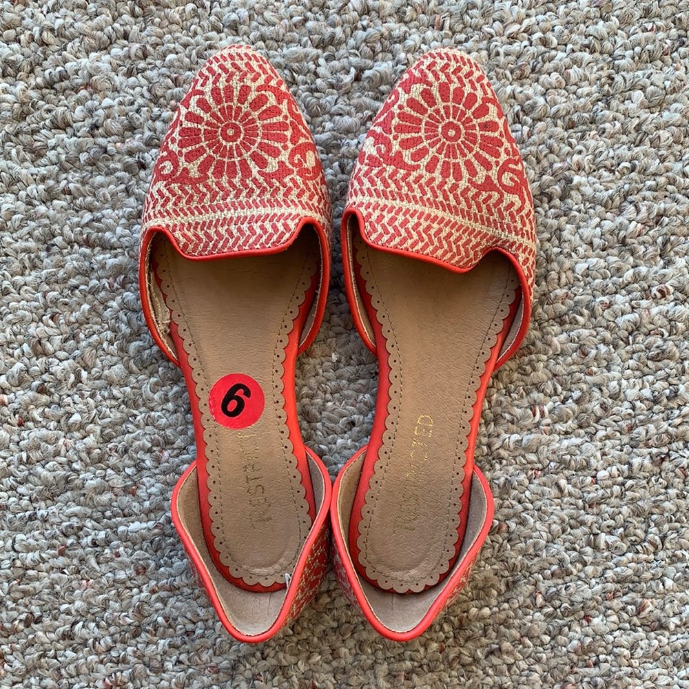 Restricted orange flats